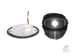 Klare Positionsleuchte mit schwarzem Sockel, in zwei Ansichten: unbeleuchtet und mit weiem Licht leuchtend.