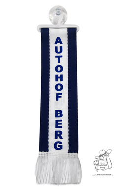 Minischal in Wei und Dunkelblau mit Aufschrift "Autohof Berg", inklusive Bgel und Saugnapf.