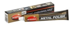 Eine goldene Autosol Metal Polish Tube und die gold-schwarze Verpackung 