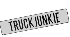 Weies Namensschild aus Blech mit schwarzem Rand und der Aufschrift 