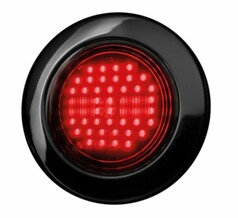 Runde, schwarze Heckleuchte mit klar getnter Polycarbonat-Linse und roten LEDs.