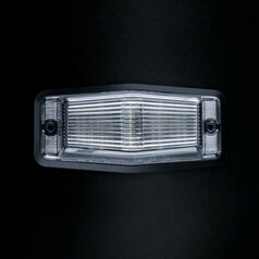 Rechteckiges LED-Positions- und Warnlicht aus Polycarbonat mit klarer, gerippter Linse und schwarzem Gehuse.