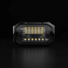 Strands UNITY Szenenlicht mit schwarzem Gehuse und gerippter klarer Linse, zeigt gelbe und weie LEDs.