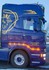 Scania R LKW-Seite mit montierten Trrohren und leuchtender oranger LED-Beleuchtung.