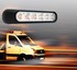 Orange LED Blitzer Warnleuchte mit schwarzem Gehuse und mehreren orangefarbenen LEDs ber einem fahrenden weien LKW.